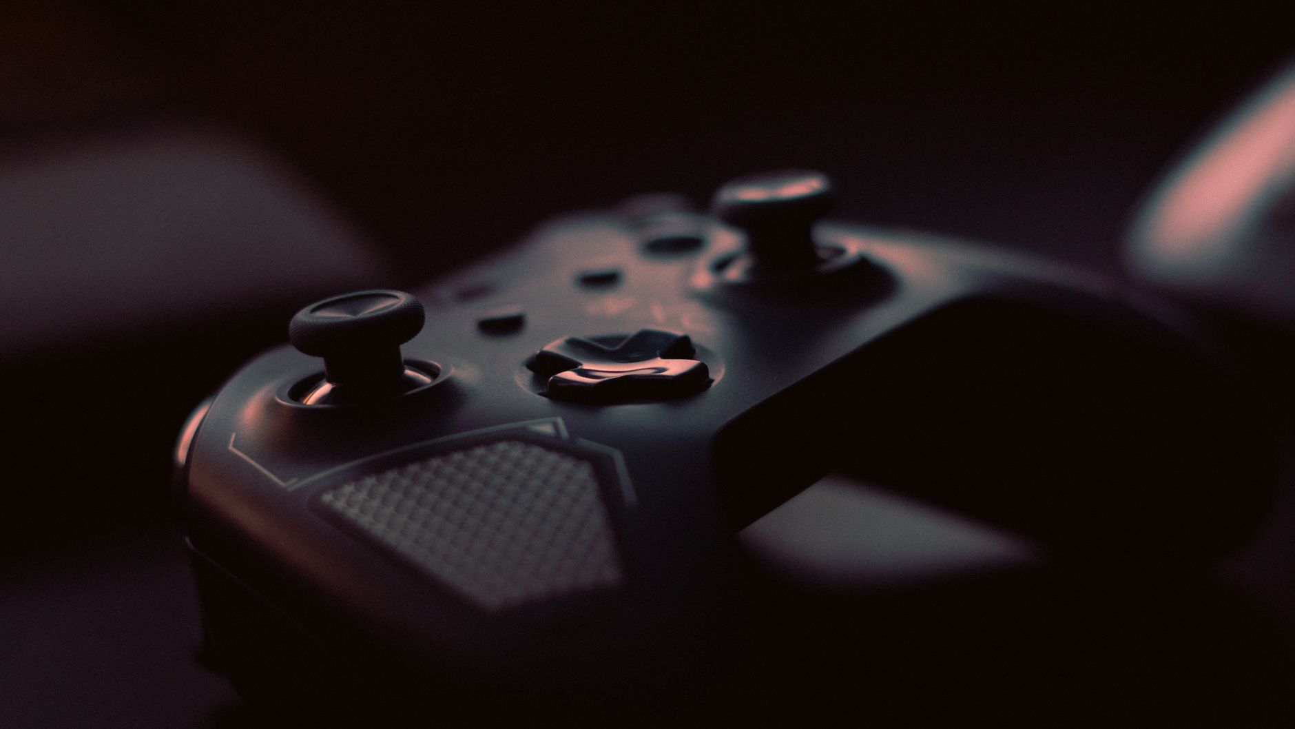 A close-up shot of a game controller in low light, highlighting its design and buttons. — How to Enjoy Live Craps Online: A B